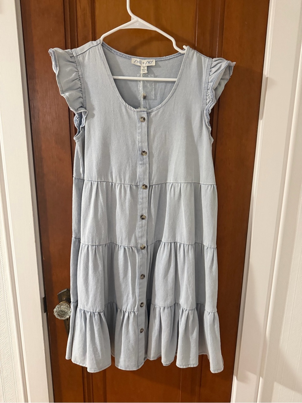 Light Blue Denim Button-Front Ruffle Tiered Dress from She + Sky